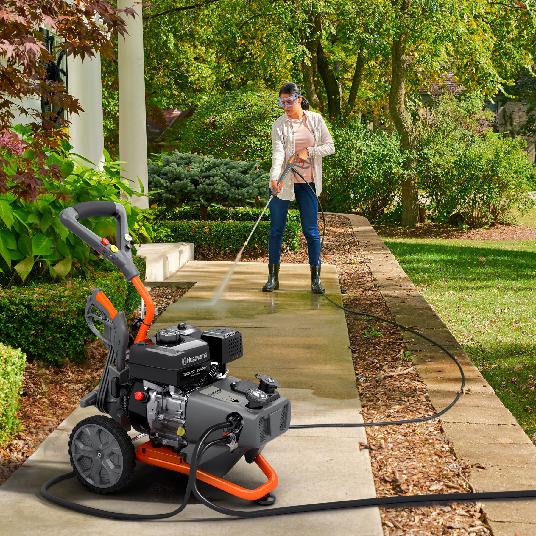 022012 Husqvarna pressure washer in use on a sidewalk